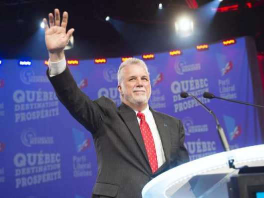 quebec-premier-philippe-couillard-waves-to-the-crow-at-the-q